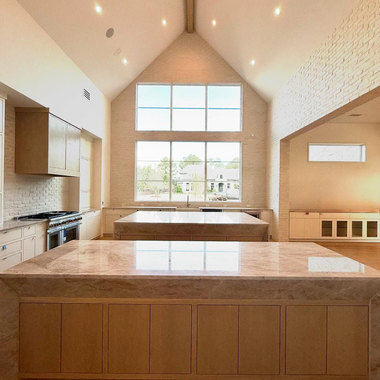 Kitchen with double islands in white oak