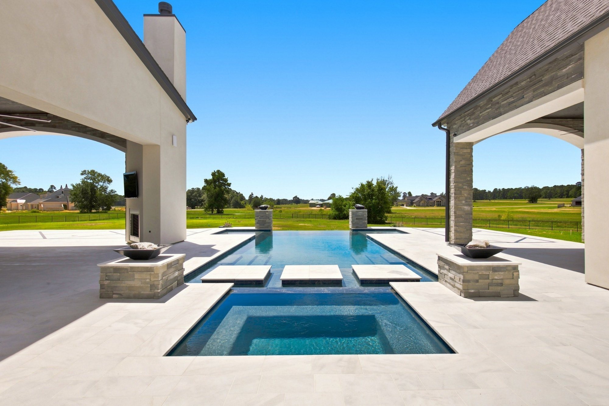 Pool and spa beside a covered cabana